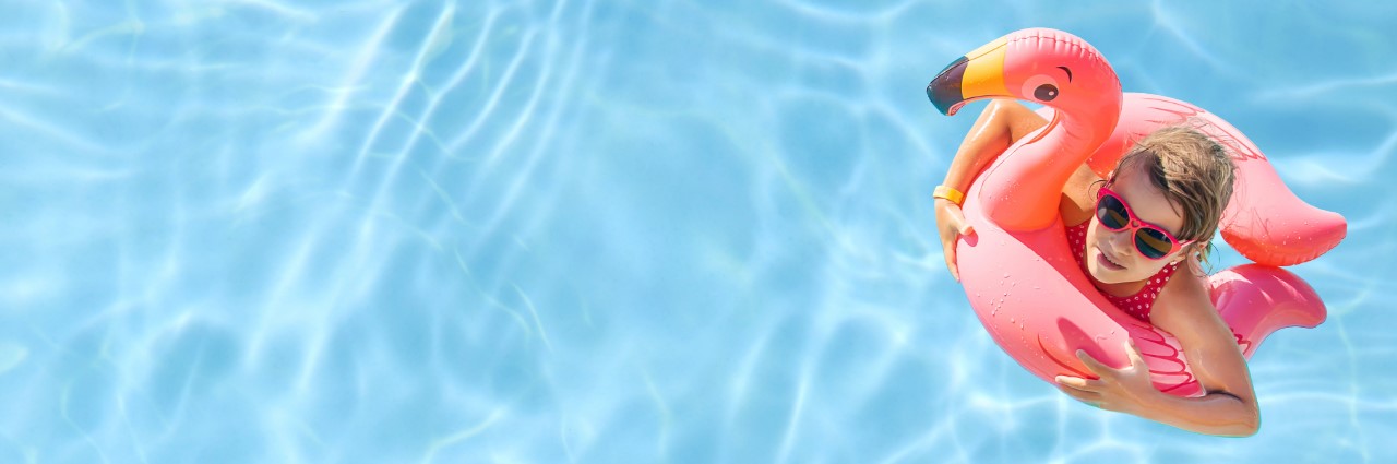 girl floating in pool