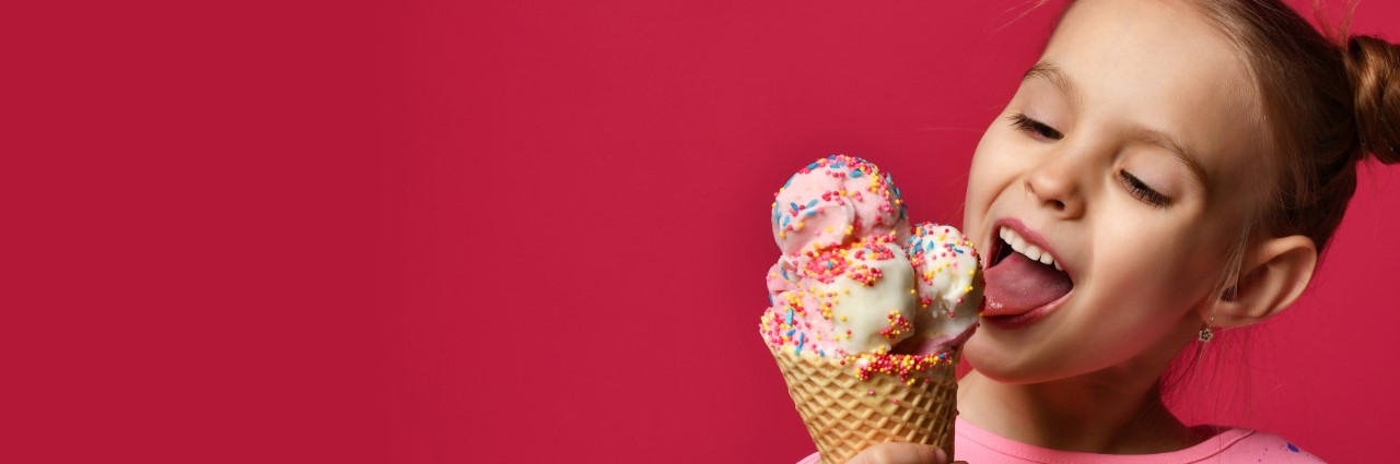 Girl licking ice cream cone